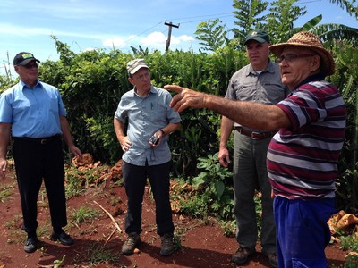 Arcel Antonio, Brad Ward and Rick Burnette look over Arcen Antonio's Farm in Colón Cuba